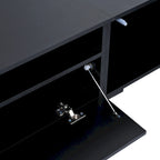 Meuble TV noir avec portes à ouverture par pression et éclairage LED