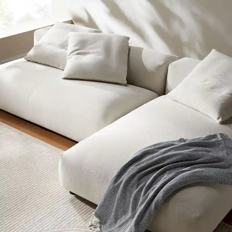 Canapé modulable en tissu rembourré avec méridienne