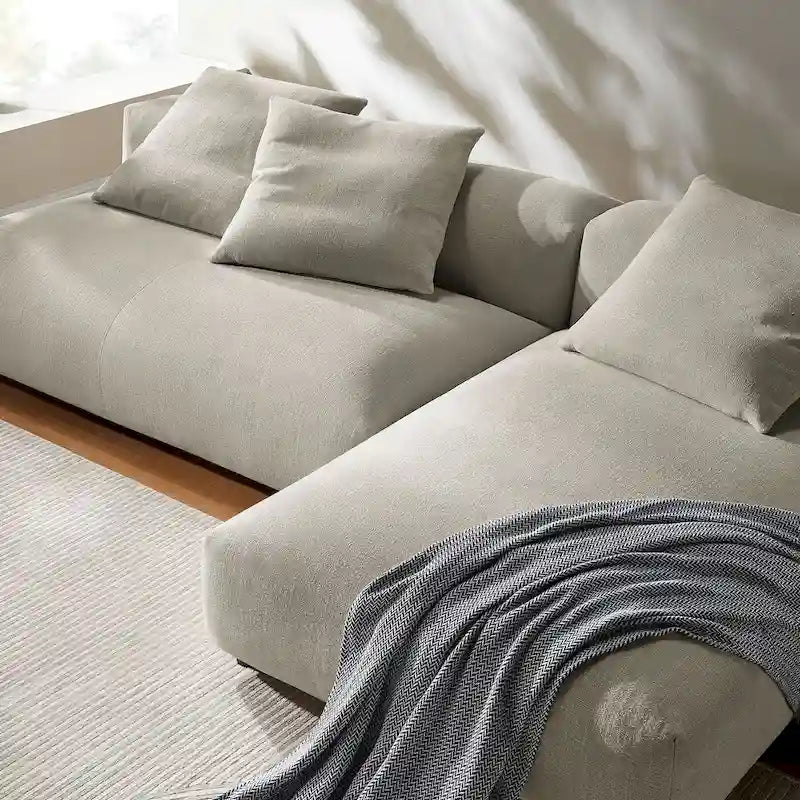 Canapé modulable en tissu rembourré avec méridienne
